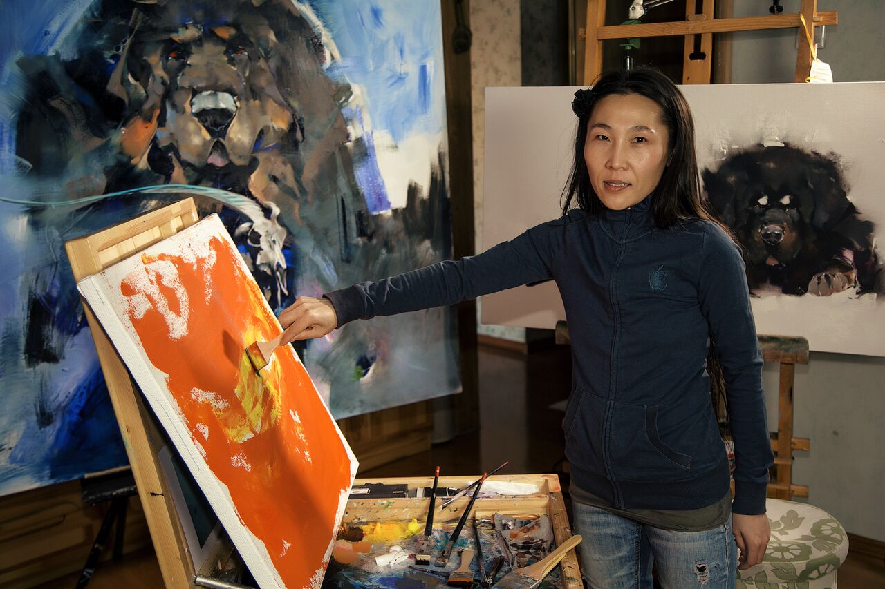 The artist Javkhaa in her studio